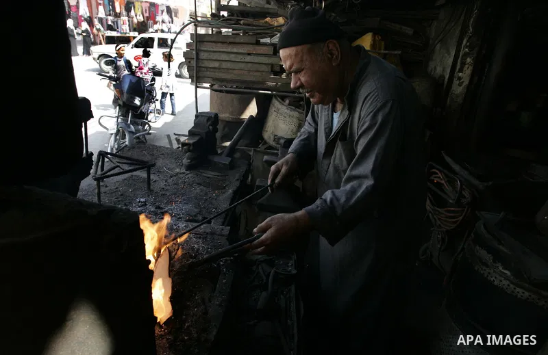 A Palestinian man works at a metal workshop in Rafah, southern Gaza Strip on Sept 28, 2011. An Israeli cabinet minister urged the government to accept a Quartet proposal for an immediate renewal of talks with the Palesti...