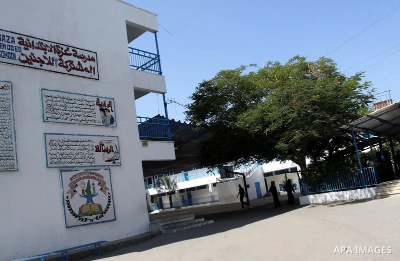 Palestinians walk in the United Nations Relief and Works Agency (UNRWA) closed school, in Gaza City on Sept. 29, 2011, against the decision made to suspend Staff Union President, Suhail al-Hindi. Some 16 thousand Palesti...