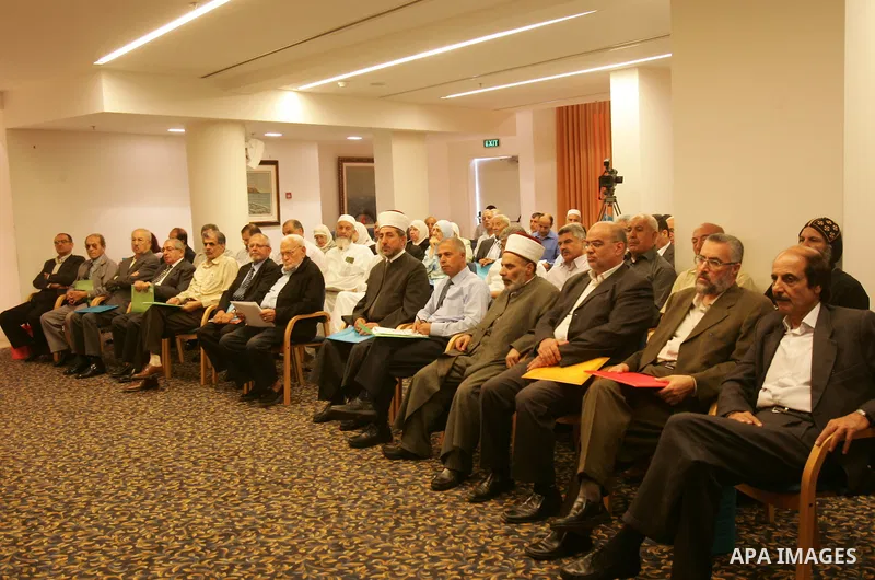Palestinians take part in a conference about Jerusalem at Ambassador hotel in east Jerusalem on Sept. 29,2011. Israel on Tuesday approved construction of 1,100 homes for Jews on the annexed land in the West Bank, a move...