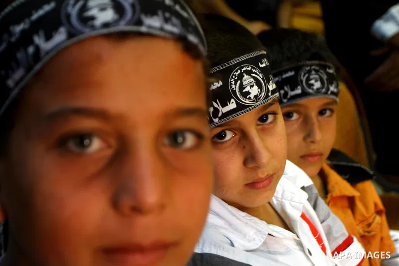 Palestinian supporters of Popular Resistance Committees take part in a rally to mark the 12th anniversary of Al-Aqsa Intifada (uprising) in Gaza city on Sept. 29,2011. Israel on Tuesday approved construction of 1,100 hom...