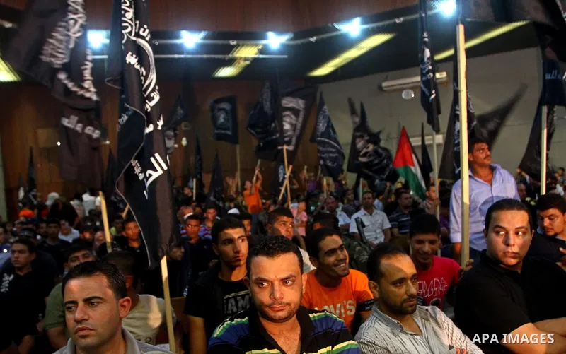 Palestinian supporters of Popular Resistance Committees take part in a rally to mark the 12th anniversary of Al-Aqsa Intifada (uprising) in Gaza city on Sept. 29,2011. Israel on Tuesday approved construction of 1,100 hom...