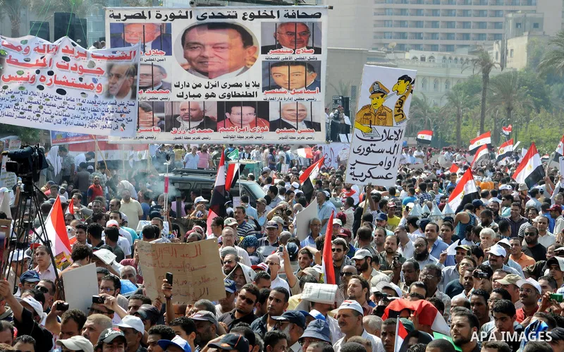 Egyptian demonstrators chant slogans during a protest at Tahrir Square in Cairo, Egypt, Friday, Sept. 30, 2011. Several thousand Egyptians are protesting against the country's military ruler's decision to retain the much...