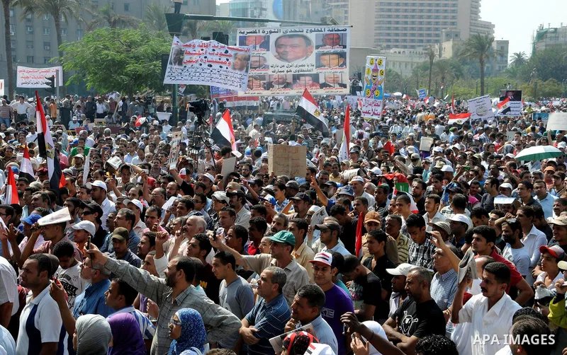 Egyptian demonstrators chant slogans during a protest at Tahrir Square in Cairo, Egypt, Friday, Sept. 30, 2011. Several thousand Egyptians are protesting against the country's military ruler's decision to retain the much...