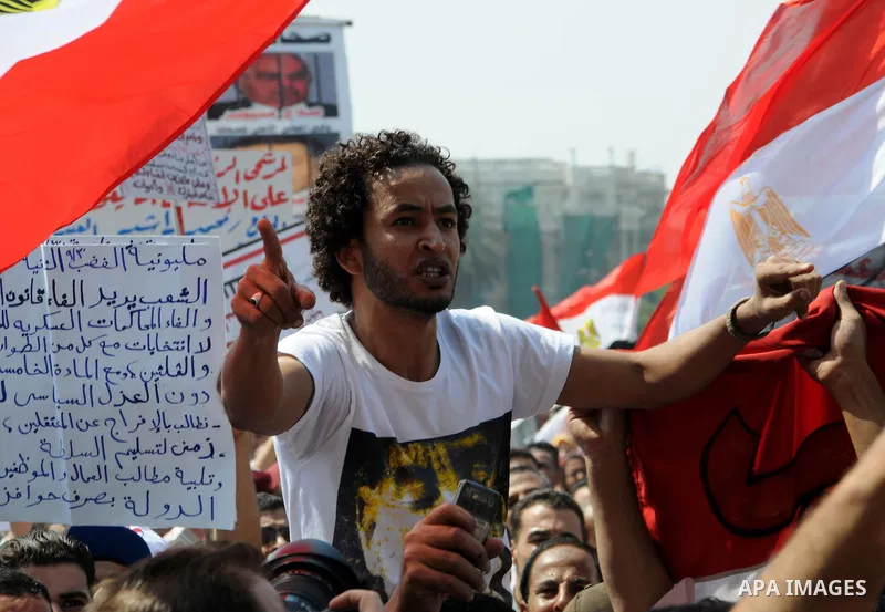 Egyptian demonstrators chant slogans during a protest at Tahrir Square in Cairo, Egypt, Friday, Sept. 30, 2011. Several thousand Egyptians are protesting against the country's military ruler's decision to retain the much...