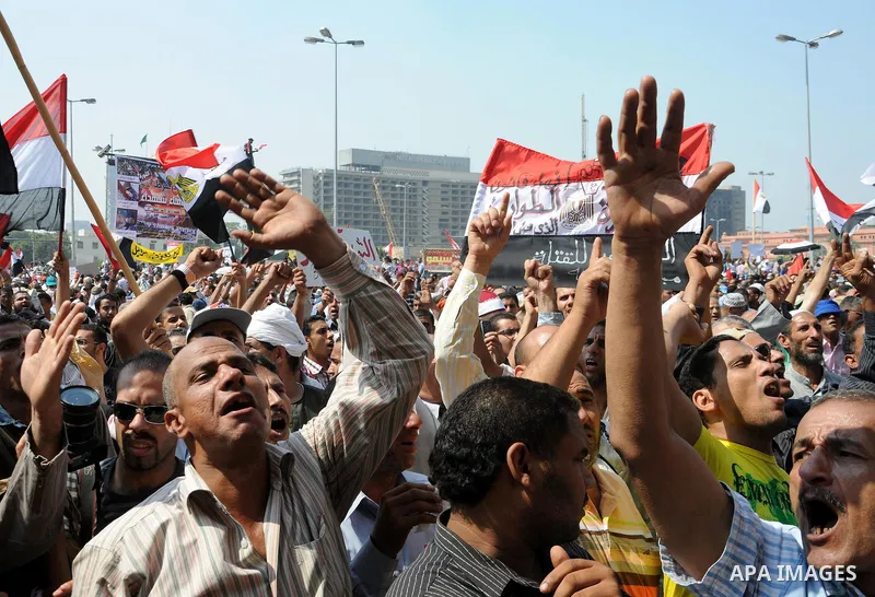 Egyptian demonstrators chant slogans during a protest at Tahrir Square in Cairo, Egypt, Friday, Sept. 30, 2011. Several thousand Egyptians are protesting against the country's military ruler's decision to retain the much...