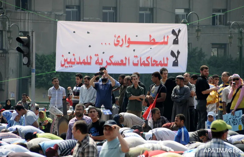 Egyptian demonstrators attend Friday prayers during a protest at Tahrir Square in Cairo, Egypt, Friday, Sept. 30, 2011. Several thousand Egyptians are protesting against the country's military ruler's decision to retain...