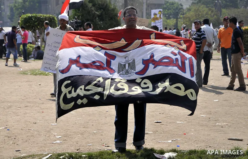 Egyptian demonstrators chant slogans during a protest at Tahrir Square in Cairo, Egypt, Friday, Sept. 30, 2011. Several thousand Egyptians are protesting against the country's military ruler's decision to retain the much...
