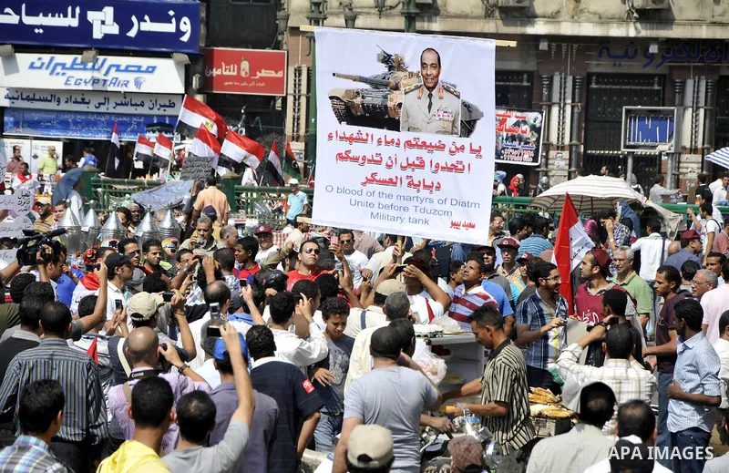 Egyptian demonstrators chant slogans during a protest at Tahrir Square in Cairo, Egypt, Friday, Sept. 30, 2011. Several thousand Egyptians are protesting against the country's military ruler's decision to retain the much...