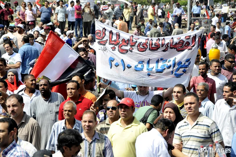 Egyptian demonstrators chant slogans during a protest at Tahrir Square in Cairo, Egypt, Friday, Sept. 30, 2011. Several thousand Egyptians are protesting against the country's military ruler's decision to retain the much...