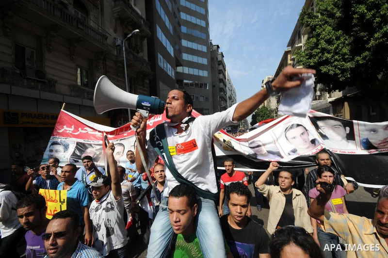 Egyptian demonstrators chant slogans during a protest at Tahrir Square in Cairo, Egypt, Friday, Sept. 30, 2011. Several thousand Egyptians are protesting against the country's military ruler's decision to retain the much...