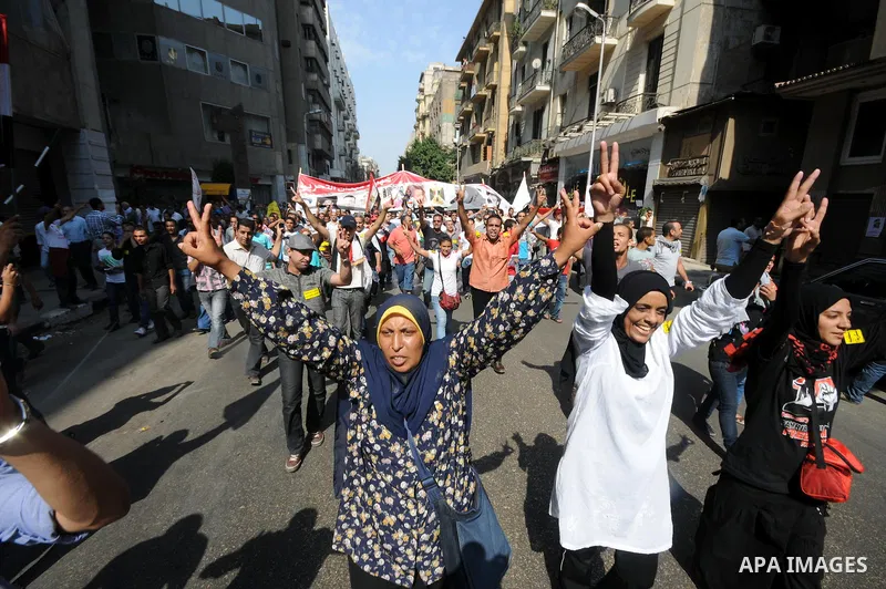 Egyptian demonstrators chant slogans during a protest at Tahrir Square in Cairo, Egypt, Friday, Sept. 30, 2011. Several thousand Egyptians are protesting against the country's military ruler's decision to retain the much...