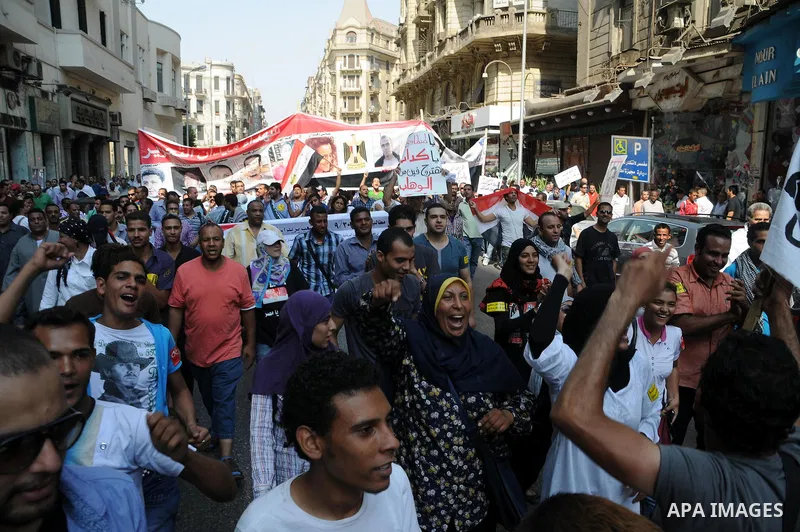Egyptian demonstrators chant slogans during a protest at Tahrir Square in Cairo, Egypt, Friday, Sept. 30, 2011. Several thousand Egyptians are protesting against the country's military ruler's decision to retain the much...