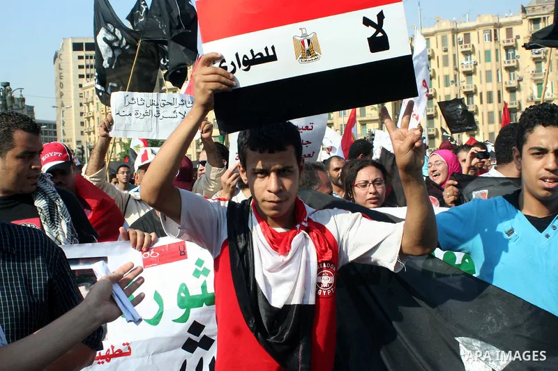 Egyptian demonstrators chant slogans during a protest at Tahrir Square in Cairo, Egypt, Friday, Sept. 30, 2011. Several thousand Egyptians are protesting against the country's military ruler's decision to retain the much...