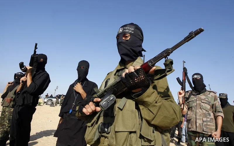 Palestinian militants from the Popular Resistance Movement participate in a training session in the southern Gaza Strip town of Khan Younis on Sept.30,2011. Israel on Tuesday approved construction of 1,100 homes for Jews...