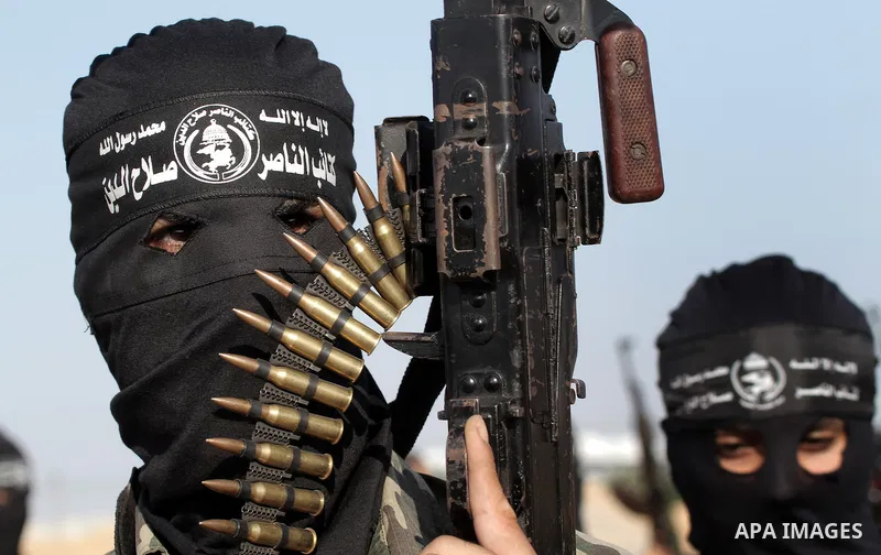Palestinian militants from the Popular Resistance Movement participate in a training session in the southern Gaza Strip town of Khan Younis on Sept.30,2011. Israel on Tuesday approved construction of 1,100 homes for Jews...