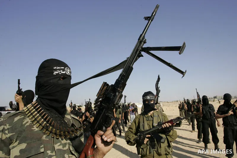 Palestinian militants from the Popular Resistance Movement participate in a training session in the southern Gaza Strip town of Khan Younis on Sept.30,2011. Israel on Tuesday approved construction of 1,100 homes for Jews...