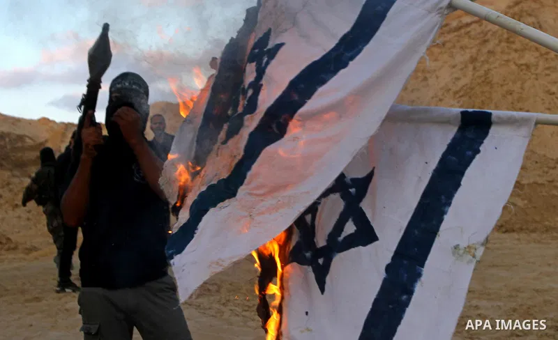 Palestinian militants from the Popular Resistance Movement participate in a training session in the southern Gaza Strip town of Khan Younis on Sept.30,2011. Israel on Tuesday approved construction of 1,100 homes for Jews...
