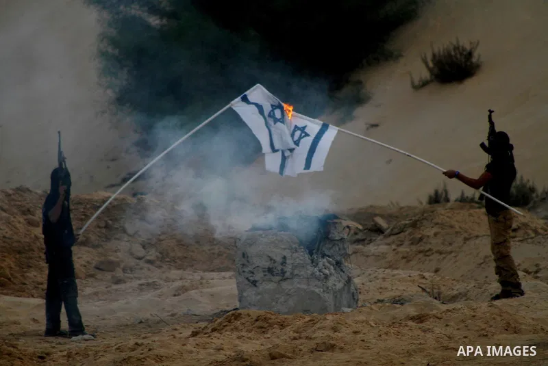 Palestinian militants from the Popular Resistance Movement participate in a training session in the southern Gaza Strip town of Khan Younis on Sept.30,2011. Israel on Tuesday approved construction of 1,100 homes for Jews...