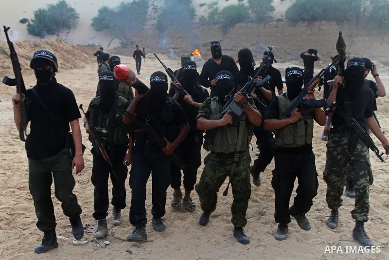 Palestinian militants from the Popular Resistance Movement participate in a training session in the southern Gaza Strip town of Khan Younis on Sept.30,2011. Israel on Tuesday approved construction of 1,100 homes for Jews...