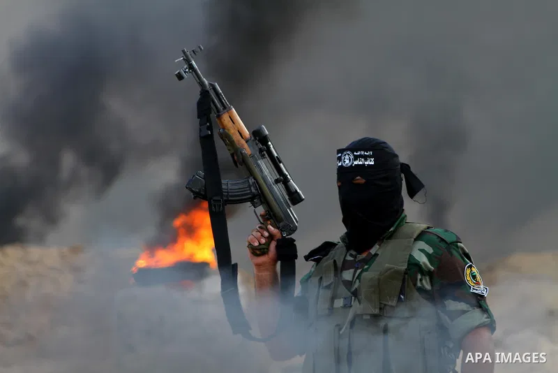 Palestinian militants from the Popular Resistance Movement participate in a training session in the southern Gaza Strip town of Khan Younis on Sept.30,2011. Israel on Tuesday approved construction of 1,100 homes for Jews...
