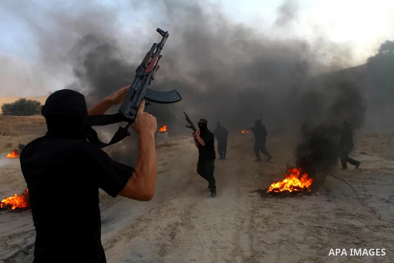 Palestinian militants from the Popular Resistance Movement participate in a training session in the southern Gaza Strip town of Khan Younis on Sept.30,2011. Israel on Tuesday approved construction of 1,100 homes for Jews...