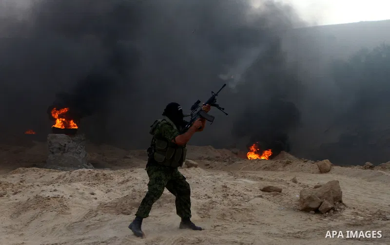 Palestinian militants from the Popular Resistance Movement participate in a training session in the southern Gaza Strip town of Khan Younis on Sept.30,2011. Israel on Tuesday approved construction of 1,100 homes for Jews...