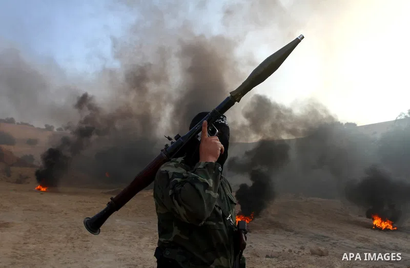 Palestinian militants from the Popular Resistance Movement participate in a training session in the southern Gaza Strip town of Khan Younis on Sept.30,2011. Israel on Tuesday approved construction of 1,100 homes for Jews...