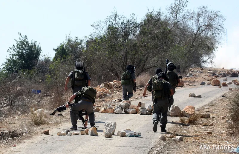 Israeli soldiers clash with Palestinian stone throwers on September 30, 2011 in the West Bank village of Kfar Kadum. Photo by Wagdi Eshtayah