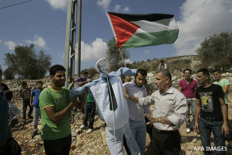 Palestinian youths stage a protest with an effigy of Israeli Prime Minister Benjamin Netanyahu on September 30, 2011 in the West Bank village of Kfar Kadum. Photo by Wagdi Eshtayah