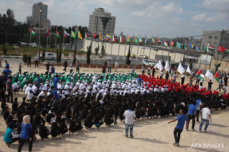 Palestinian children with their bodies make up the Palestinian flag ,in the West Bank city of Ramallah October 1, 2011. A U.N. Security Council panel on admitting new members to the United Nations met on Friday for the f...