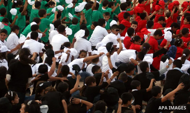 Palestinian children with their bodies make up the Palestinian flag ,in the West Bank city of Ramallah October 1, 2011. A U.N. Security Council panel on admitting new members to the United Nations met on Friday for the f...