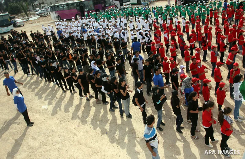 Palestinian children with their bodies make up the Palestinian flag ,in the West Bank city of Ramallah October 1, 2011. A U.N. Security Council panel on admitting new members to the United Nations met on Friday for the f...