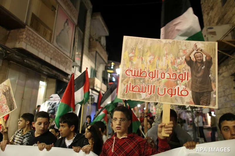 Hundreds of families of Palestinian prisoners held in Israeli jails protest in downtown Ramallah in the West Bank on October 1, 2011 in support of prisoners on hunger strike for a third day. Photo by Issam Rimawi