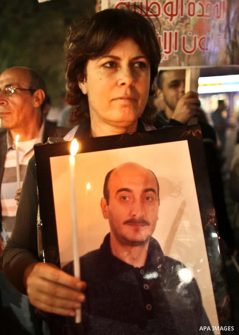 Hundreds of families of Palestinian prisoners held in Israeli jails protest in downtown Ramallah in the West Bank on October 1, 2011 in support of prisoners on hunger strike for a third day. Photo by Issam Rimawi