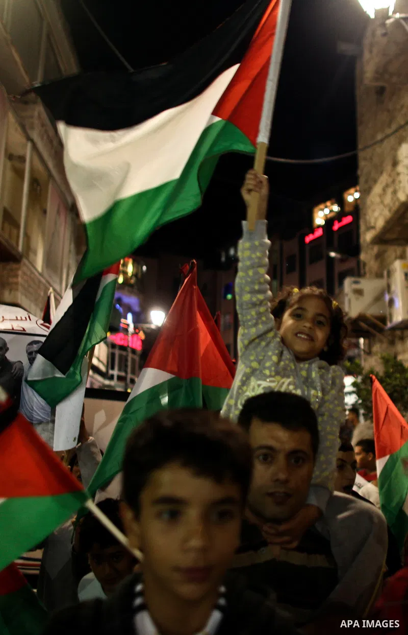 Hundreds of families of Palestinian prisoners held in Israeli jails protest in downtown Ramallah in the West Bank on October 1, 2011 in support of prisoners on hunger strike for a third day. Photo by Issam Rimawi