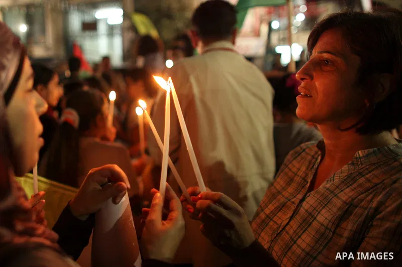 Hundreds of families of Palestinian prisoners held in Israeli jails protest in downtown Ramallah in the West Bank on October 1, 2011 in support of prisoners on hunger strike for a third day. Photo by Issam Rimawi