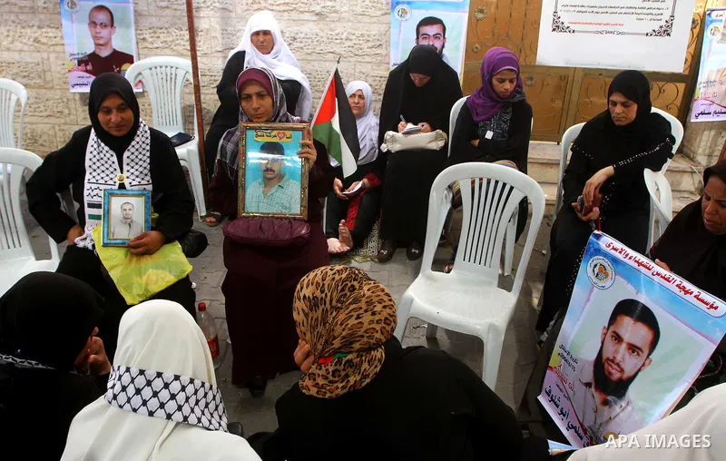 Families of Palestinian prisoners held in Israeli jails protest outside the International Committee of the Red Cross (ICRC) offices in Gaza City on October 2, 2011 in support of prisoners on hunger strike. Photo by Ashra...