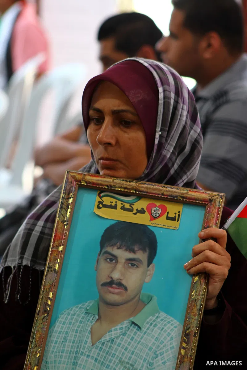Families of Palestinian prisoners held in Israeli jails protest outside the International Committee of the Red Cross (ICRC) offices in Gaza City on October 2, 2011 in support of prisoners on hunger strike. Photo by Ashra...