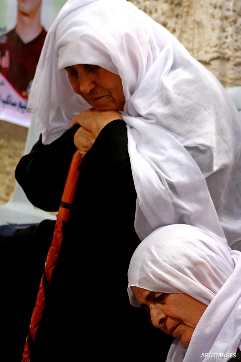 Families of Palestinian prisoners held in Israeli jails protest outside the International Committee of the Red Cross (ICRC) offices in Gaza City on October 2, 2011 in support of prisoners on hunger strike. Photo by Ashra...