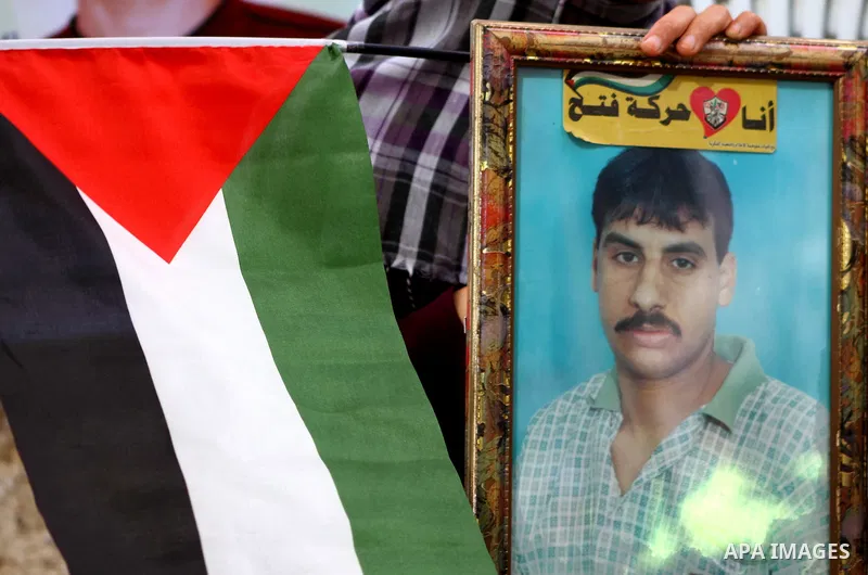 Families of Palestinian prisoners held in Israeli jails protest outside the International Committee of the Red Cross (ICRC) offices in Gaza City on October 2, 2011 in support of prisoners on hunger strike. Photo by Ashra...
