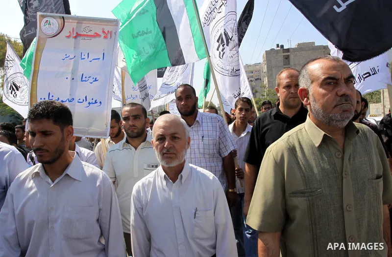 Families of Palestinian prisoners held in Israeli jails take part during a protest outside the International Committee of the Red Cross (ICRC) offices in Gaza City on October 3, 2011 in support of prisoners on hunger str...