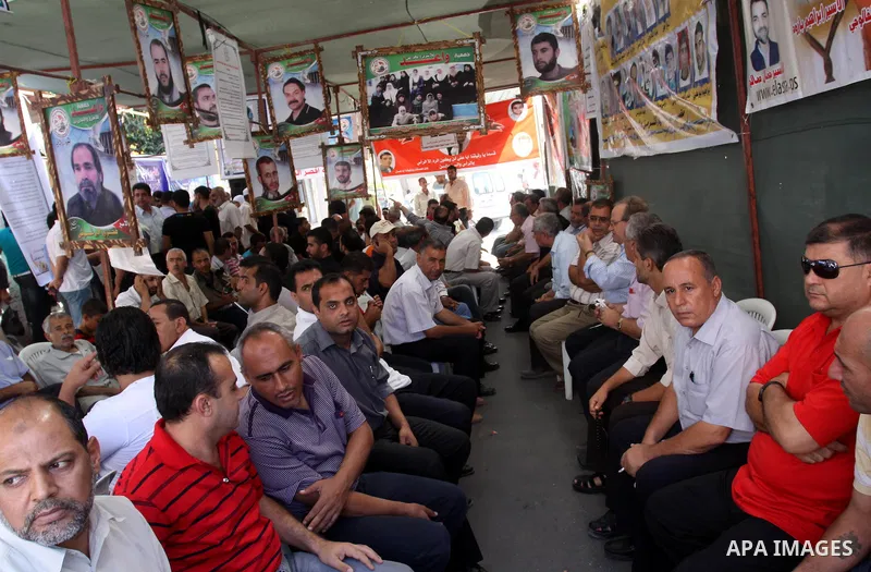 Families of Palestinian prisoners held in Israeli jails take part during a protest at the Red Cross headquarters in Gaza City on October 3, 2011 in support of prisoners on hunger strike. Photo by Mohammed Asad