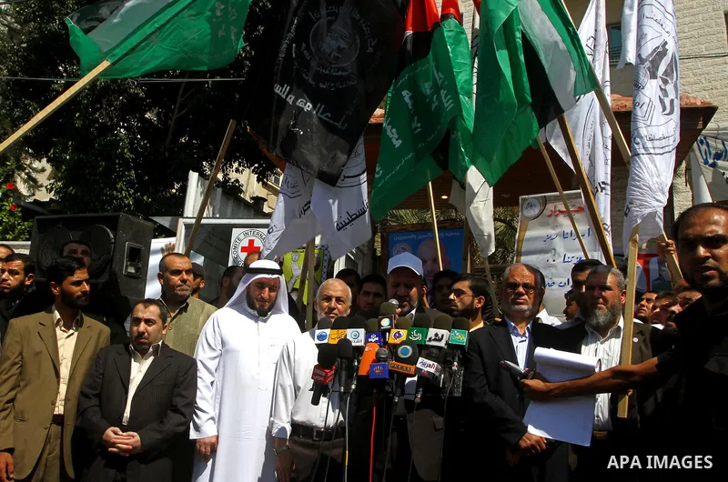 Palestinians deliver speech in a protest at the Red Cross headquarters in Gaza City on October 3, 2011, to show their solidarity with Palestinian prisoners held in Israeli jails. On Wednesday, Palestinian prisoners in Is...