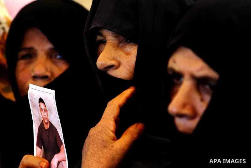 Palestinians take part in a protest at the Red Cross headquarters in Gaza City on October 3, 2011, to show their solidarity with Palestinian prisoners held in Israeli jails. On Wednesday, Palestinian prisoners in Israel...