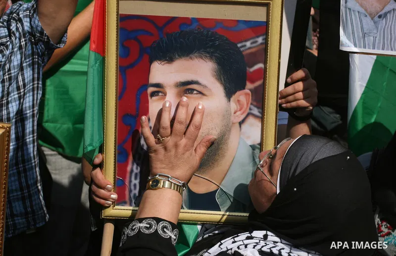 Palestinians attend a demonstration calling for the release of prisoners held in Israeli jails and in support of inmates in hunger strike, on October 3, 2011 in the West Bank city of Ramallah. Thousands of Palestinian in...