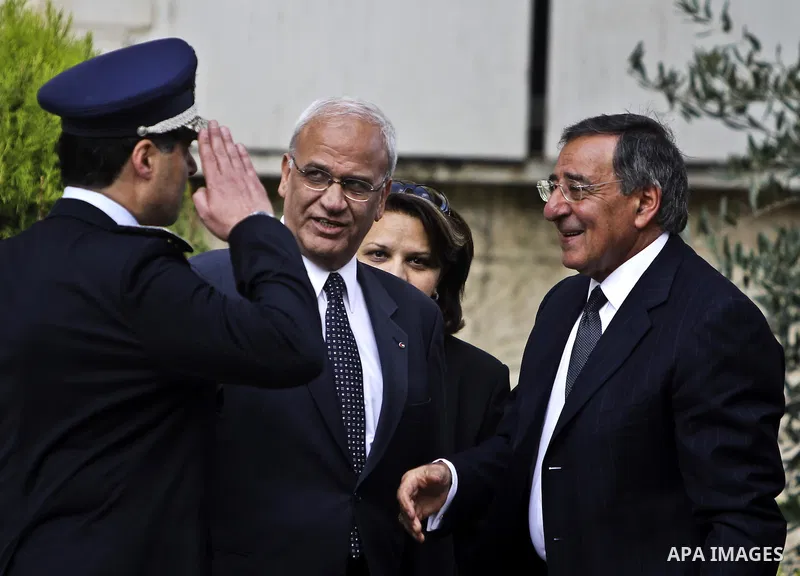 U.S. Defence Secretary Leon Panetta (R) saluted upon his arrival for a meeting with Palestinian president Mahmoud Abbas, by Palestinian chief of police Major General Hazem Attallah, as he stands Palestinians Cheif negoti...