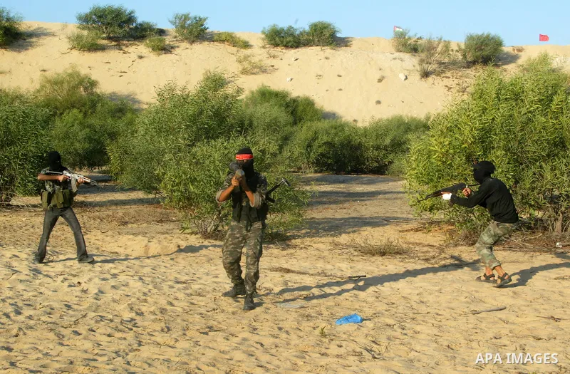 Palestinian militants with the Democratic Front for the Liberation of Palestine (DFLP) take part in a training session in the southern Gaza Strip town of Khan Yunis on October 03, 2011. Photo by Abed Rahim Khatib