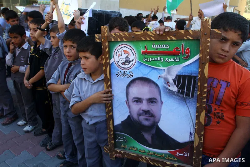 Palestinian students take part in a protest demanding for release of Palestinian prisoners in Israeli jails, at the Red Cross head headquarters in Gaza City on Oct. 4, 2011. Palestinians continue their protests in the We...