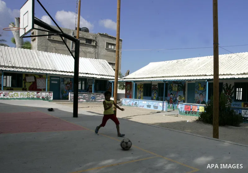 A Palestinian child plays in an empty school because of a strike of teachers at a school in Rafah, southern Gaza Strip on October 5, 2011. Union officials called the United Nations Relief and Works Agency (UNRWA) employe...