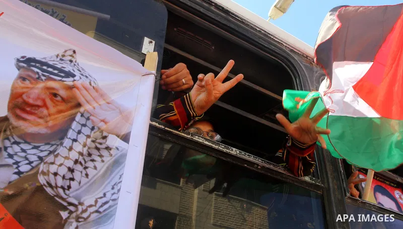 Palestinians take part in a protest near the Erez border crossing between Israel and northern Gaza Strip October 5, 2011, to show their solidarity with Palestinian prisoners held in Israeli jails. Hundreds of Palestinian...
